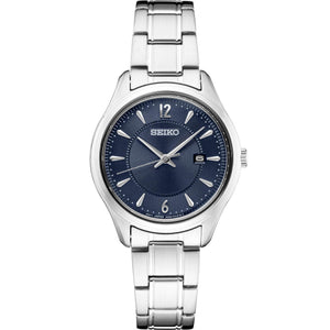Front view of Seiko SUR425 watch showcasing blue sunburst dial, date window, and stainless steel bracelet on white background