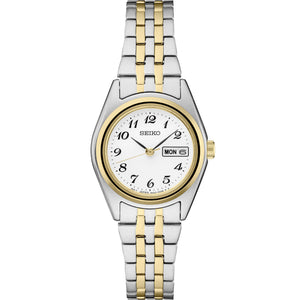 Front view of Seiko SUR438 two-tone stainless watch with white dial, Arabic numerals, day-date window, and two-tone bracelet